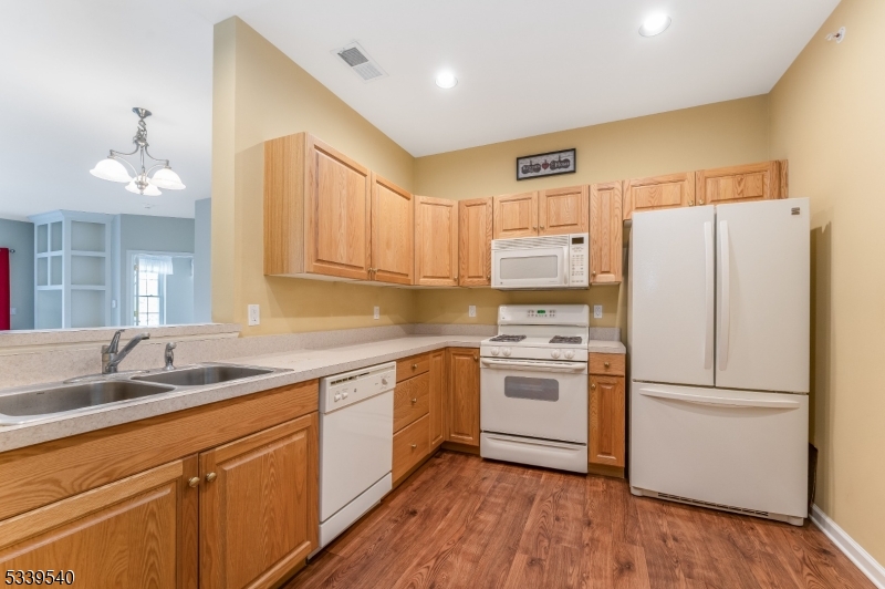 6015 Brookfield Glen Drive, Unit 15 Belvidere, NJ 07823 - Photo 2 of 48 a kitchen with stainless steel appliances a refrigerator sink and cabinets