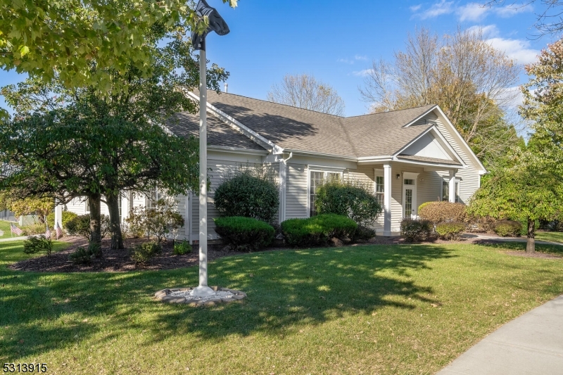 6015 Brookfield Glen Drive, Unit 15 Belvidere, NJ 07823 - Photo 23 of 48 a view of a house with a big yard plants and large trees