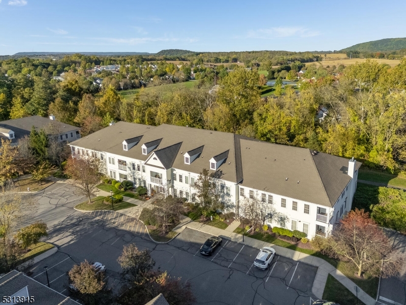 6015 Brookfield Glen Drive, Unit 15 Belvidere, NJ 07823 - Photo 38 of 48 an aerial view of residential houses with outdoor space