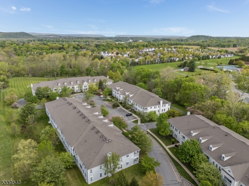 6015 Brookfield Glen Drive, Unit 15 Belvidere, NJ 07823 - Photo 41 of 48 an aerial view of residential houses with outdoor space and river