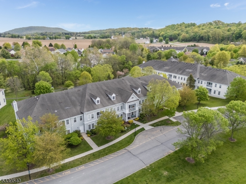 6015 Brookfield Glen Drive, Unit 15 Belvidere, NJ 07823 - Photo 45 of 48 an aerial view of residential houses with outdoor space and trees