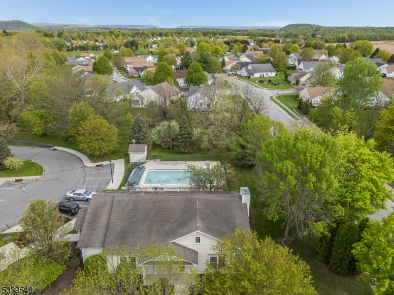 6015 Brookfield Glen Drive, Unit 15 Belvidere, NJ 07823 - Photo 47 of 48 an aerial view of residential houses with outdoor space