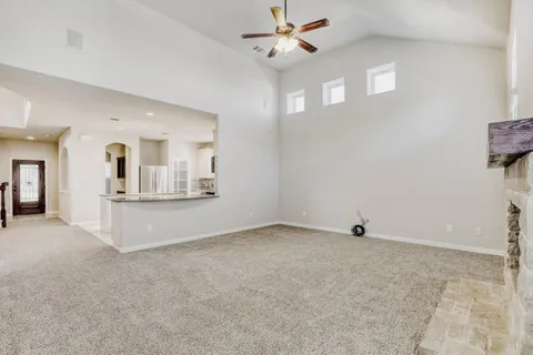 a view of a livingroom with a kitchen
