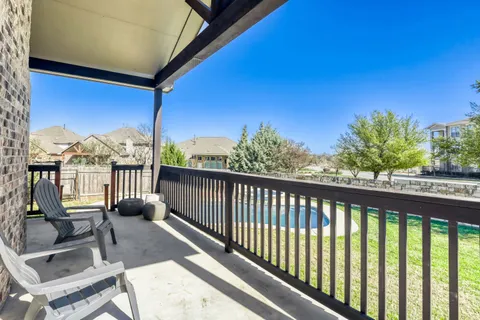 a view of balcony with furniture