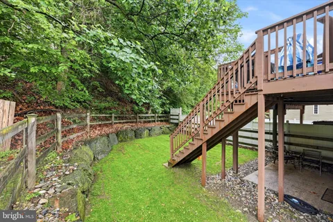 a view of an house with a swimming pool and sitting area