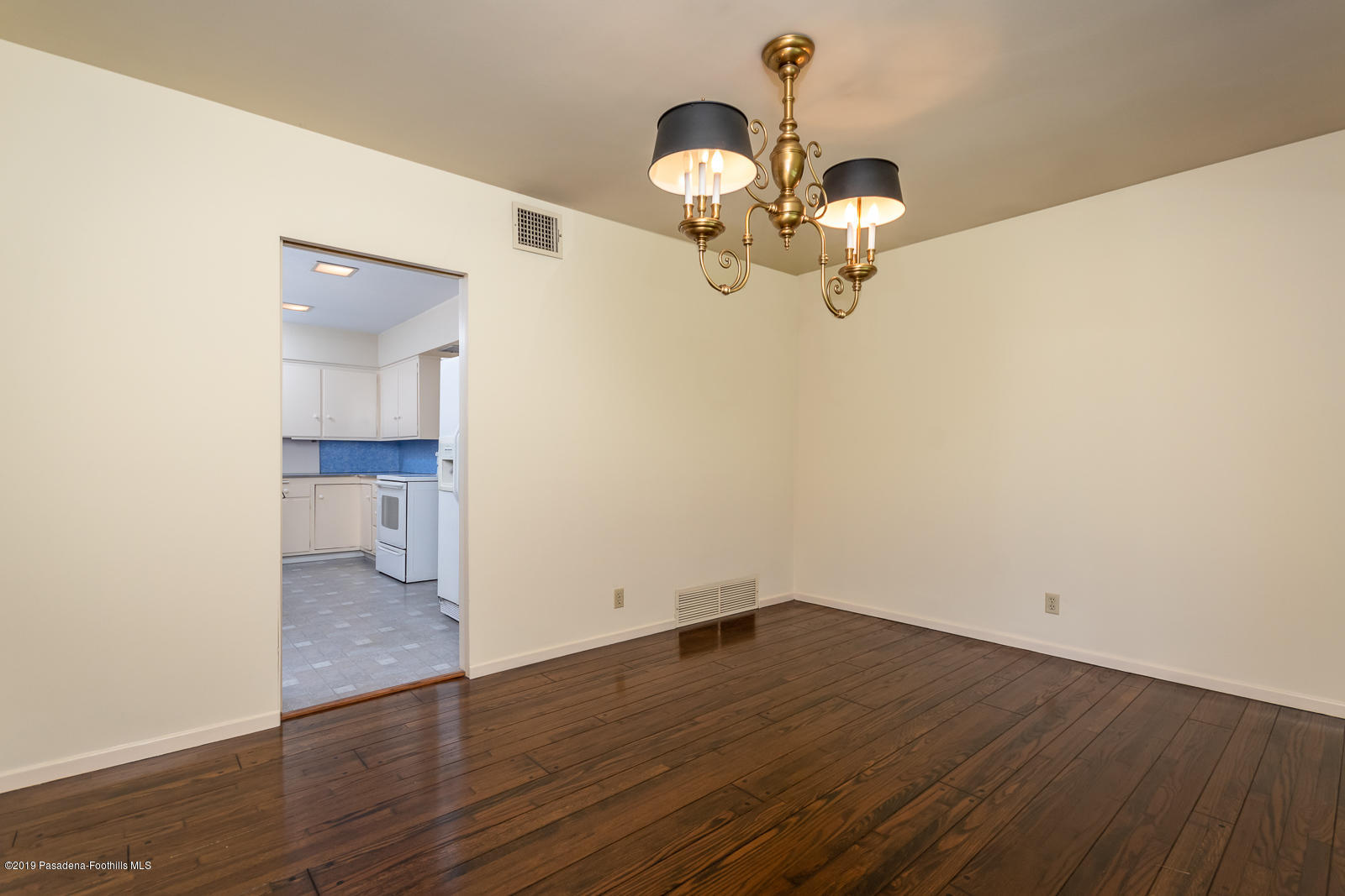 3810 Greenhill Road Pasadena, CA 91107 - Photo 11 of 29 a view of a room with wooden floor and white walls