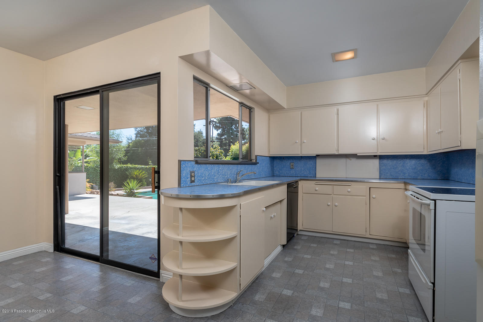 3810 Greenhill Road Pasadena, CA 91107 - Photo 12 of 29 a kitchen with a stove a sink and a refrigerator