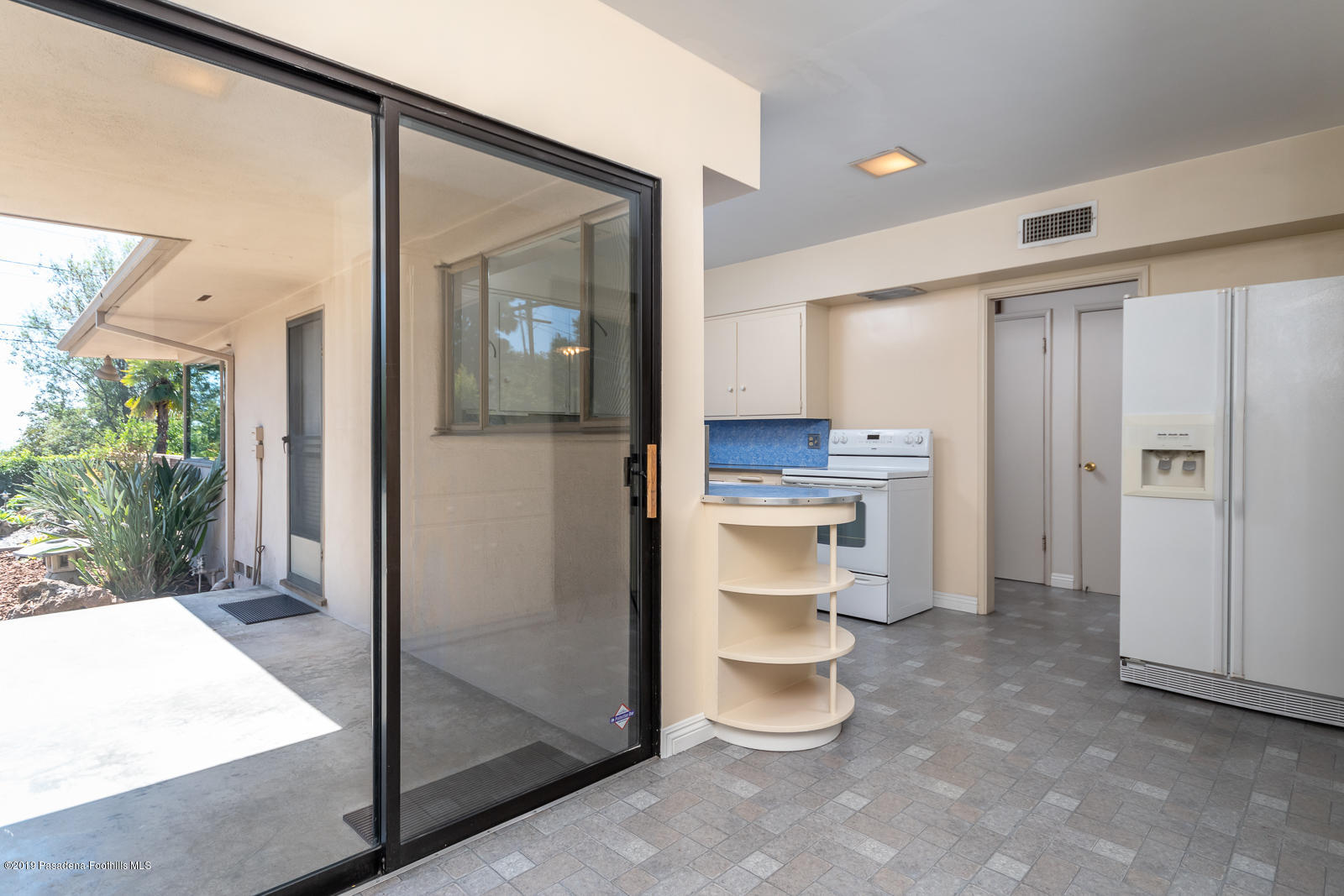 3810 Greenhill Road Pasadena, CA 91107 - Photo 13 of 29 a room with a walk in closet and a large window