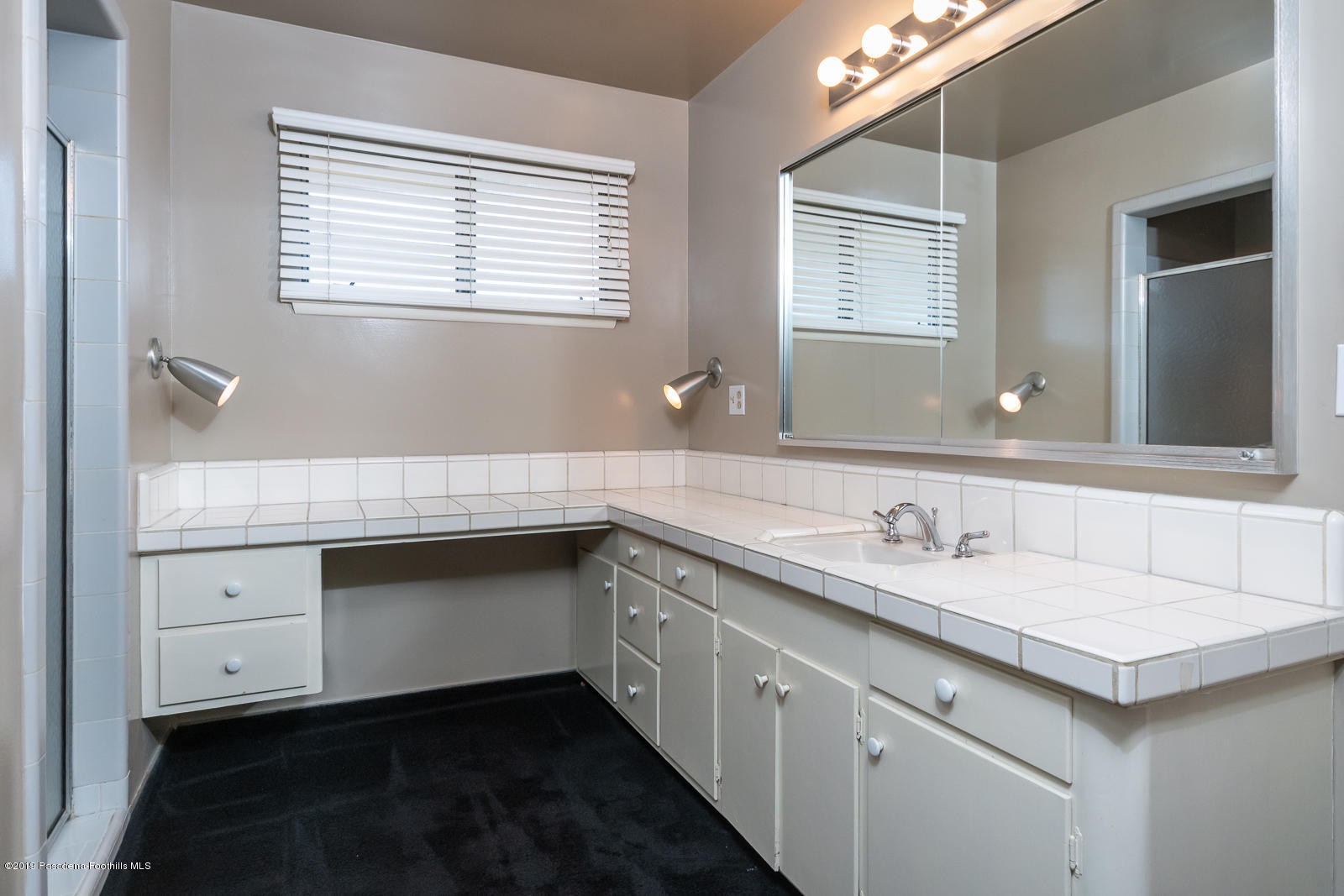 3810 Greenhill Road Pasadena, CA 91107 - Photo 19 of 29 a bathroom with a sink and a mirror