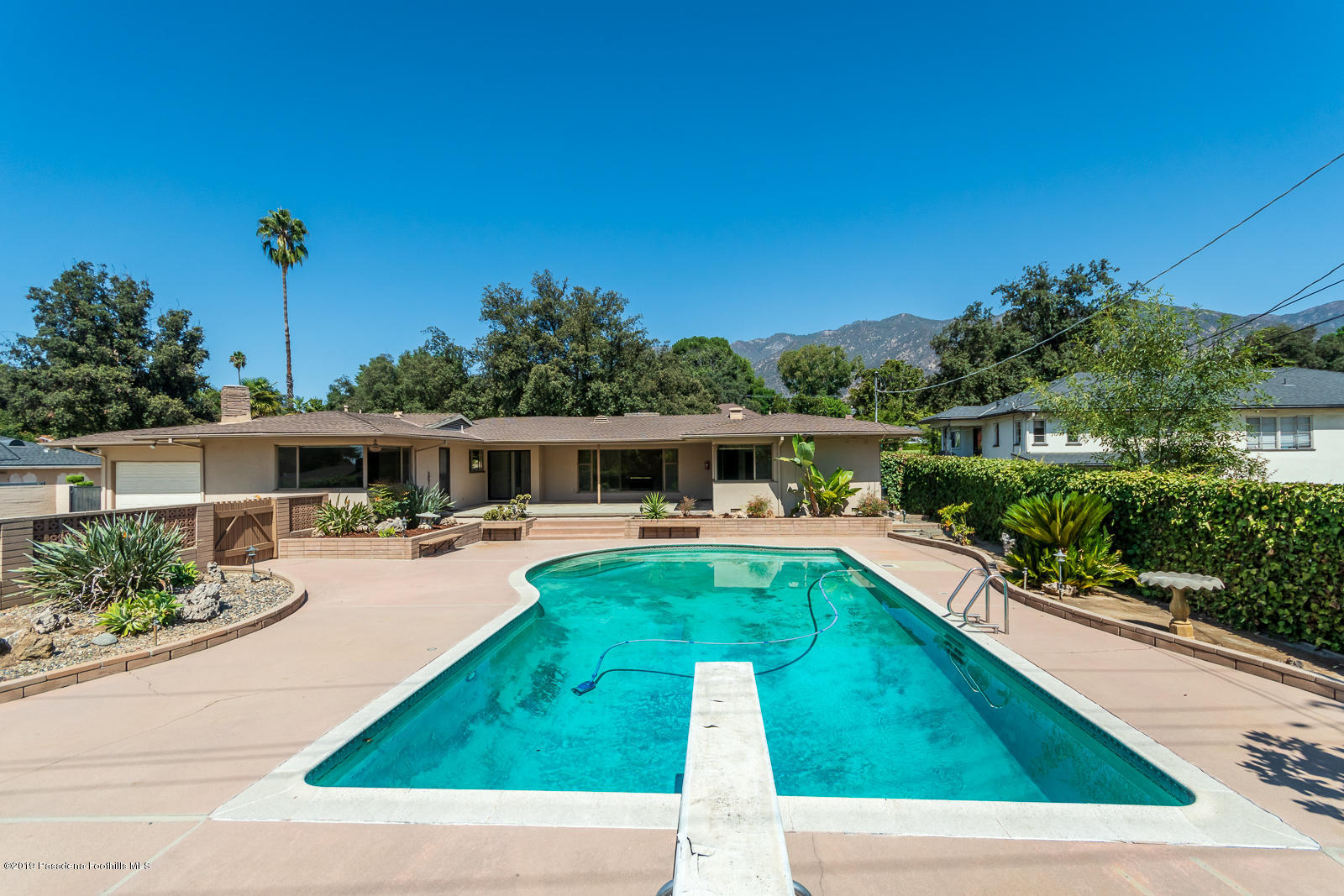 3810 Greenhill Road Pasadena, CA 91107 - Photo 25 of 29 a view of a swimming pool with a patio