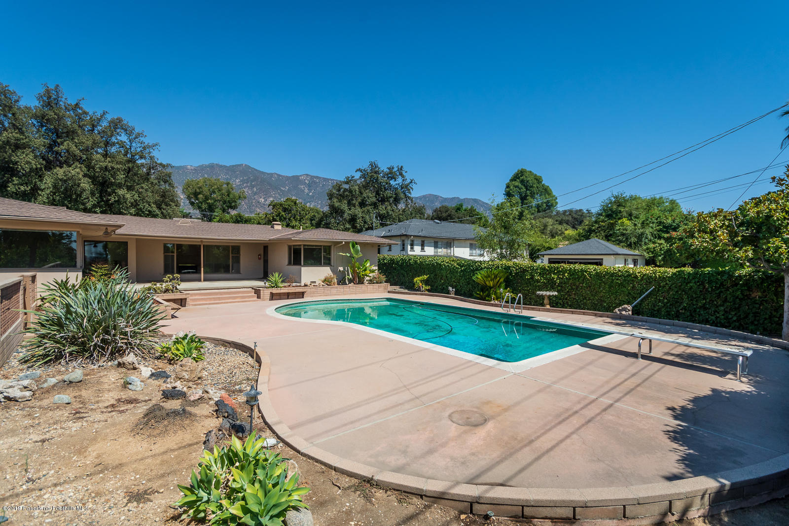 3810 Greenhill Road Pasadena, CA 91107 - Photo 26 of 29 front view of house with a yard