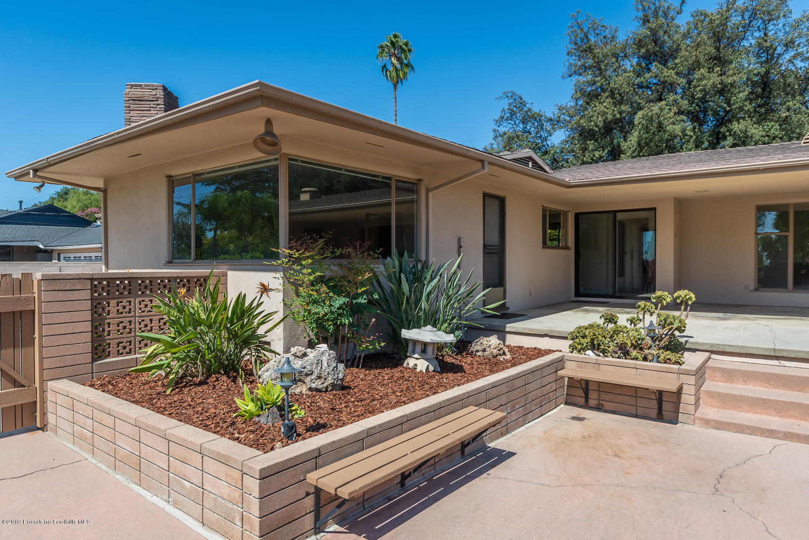 3810 Greenhill Road Pasadena, CA 91107 - Photo 27 of 29 a front view of a house with a yard