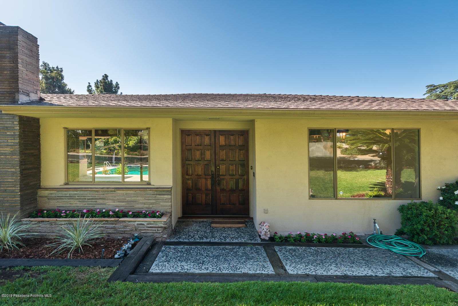 3810 Greenhill Road Pasadena, CA 91107 - Photo 4 of 29 a front view of a house with garden