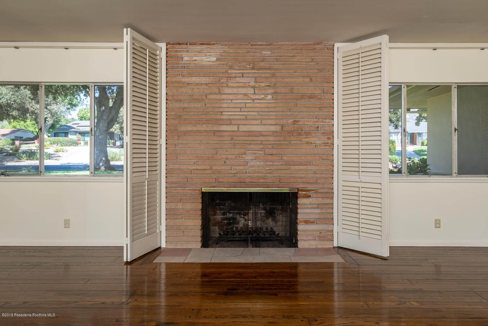 3810 Greenhill Road Pasadena, CA 91107 - Photo 6 of 29 a living room with a fireplace