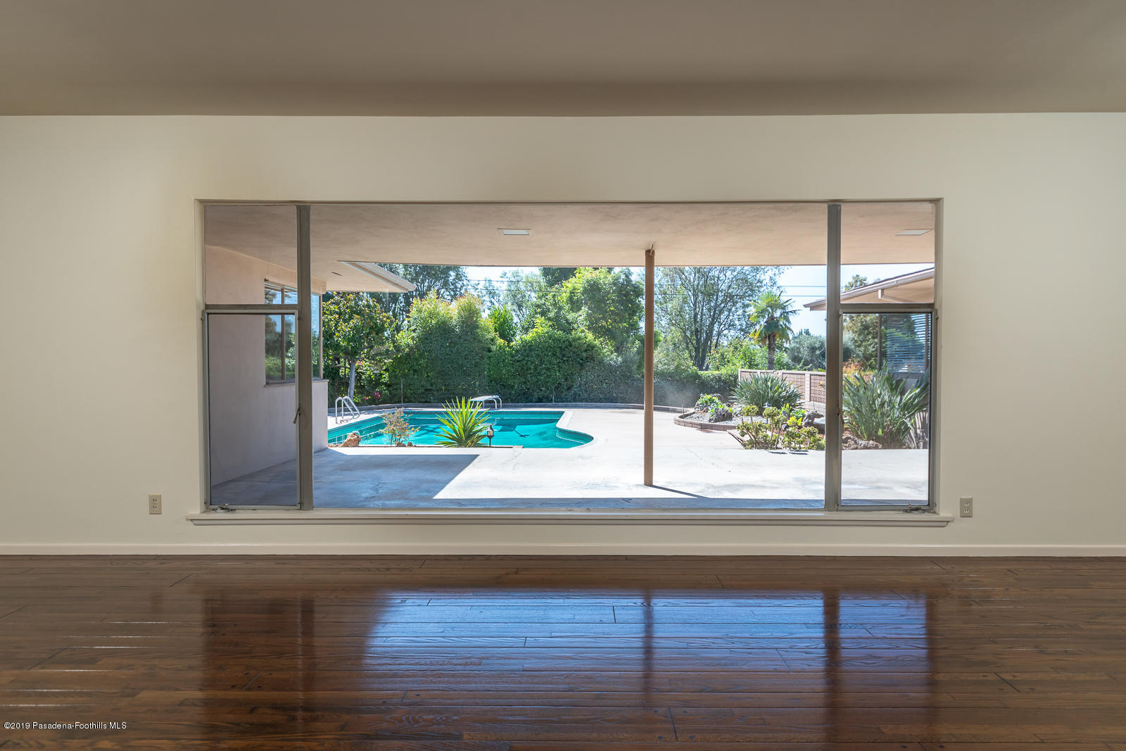 3810 Greenhill Road Pasadena, CA 91107 - Photo 7 of 29 a room with a large window