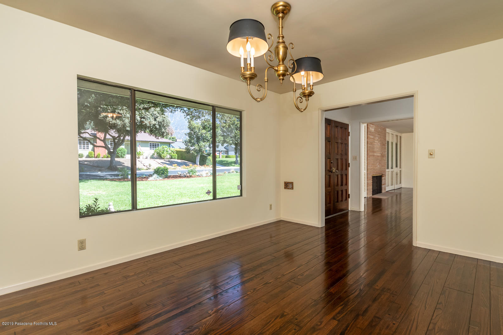 3810 Greenhill Road Pasadena, CA 91107 - Photo 10 of 29 a view of a room with wooden floor chandelier and windows