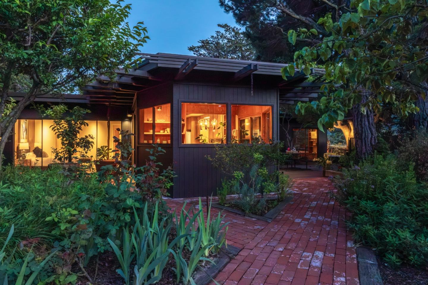 46 Middle Canyon Road Carmel Valley, CA 93924 - Photo 52 of 74 a view of a porch with a table and chairs under an umbrella