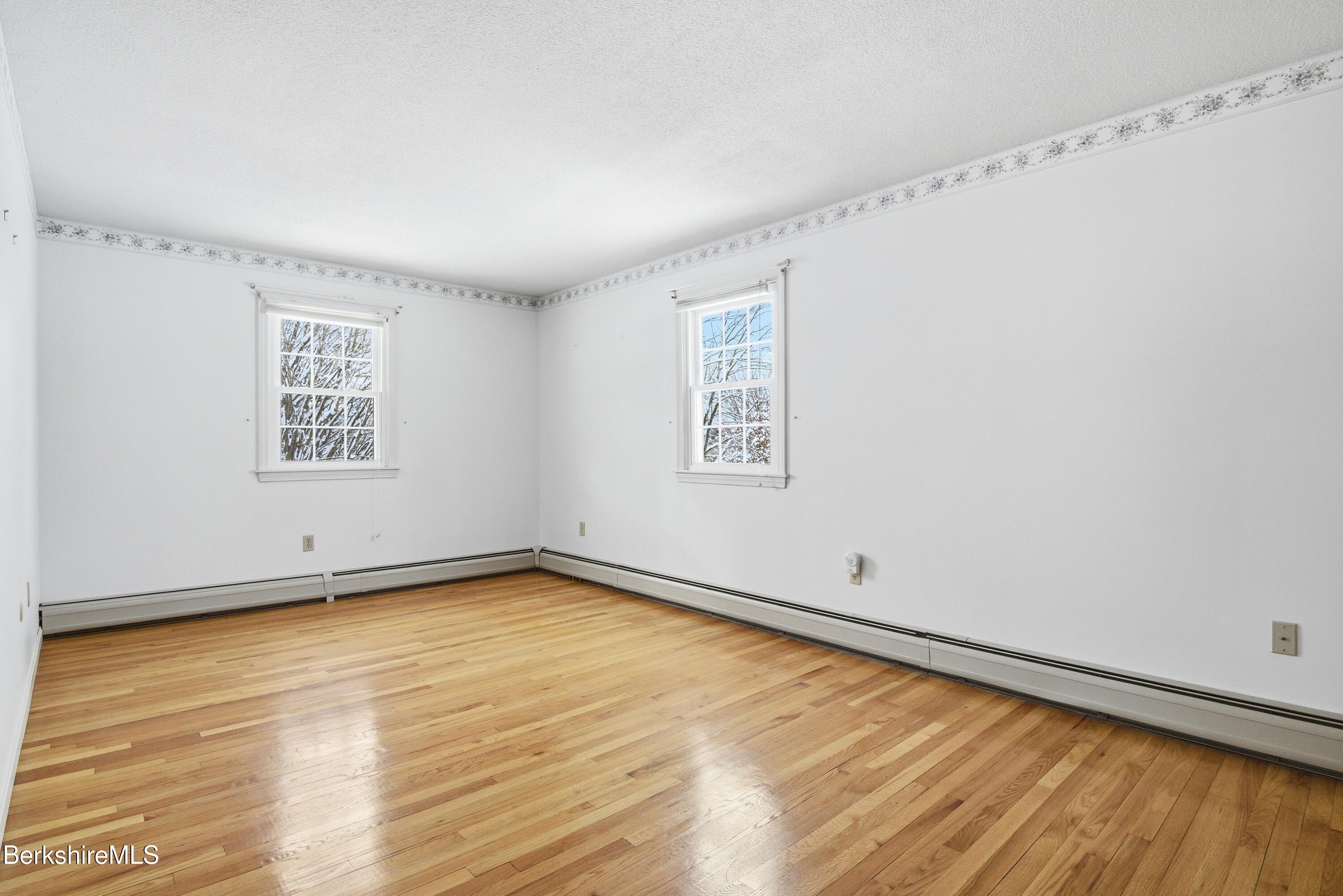 121 Kittredge Road Pittsfield, MA 01201 - Photo 24 of 38 a view of a room with wooden floor and white walls