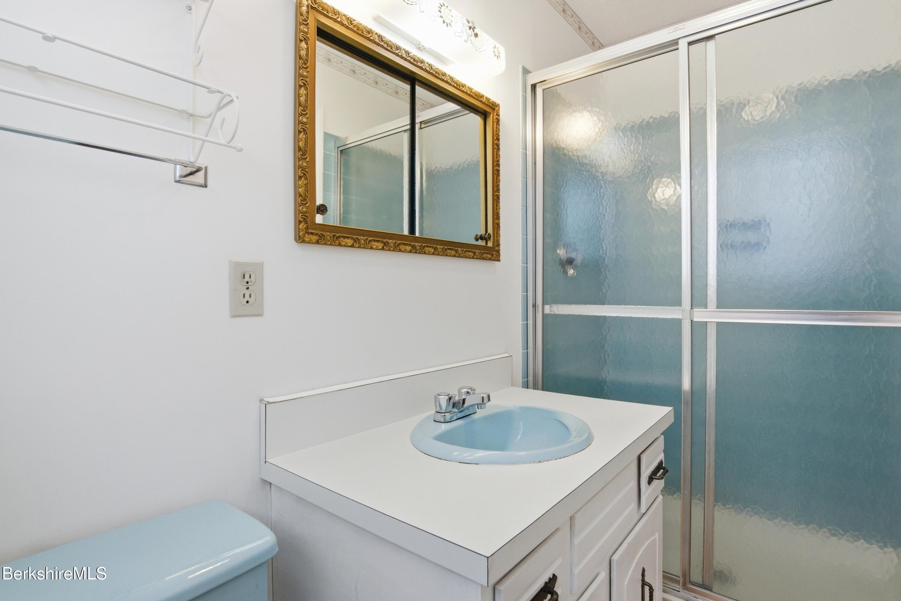 121 Kittredge Road Pittsfield, MA 01201 - Photo 25 of 38 a bathroom with a sink toilet and mirror