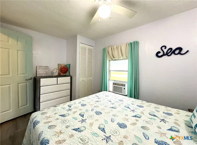 a bedroom with a bed and a dresser