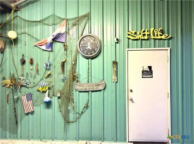 a view of a patio with table and chairs a barbeque with wooden fence
