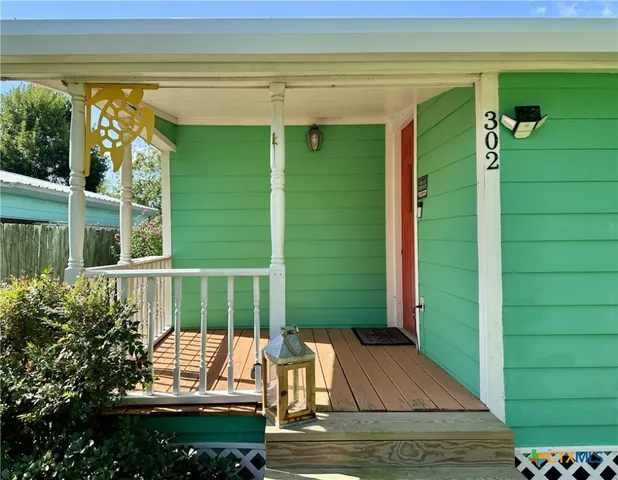 a view of a two chairs in the balcony