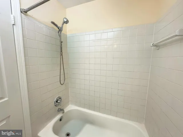 a view of room with wooden floor