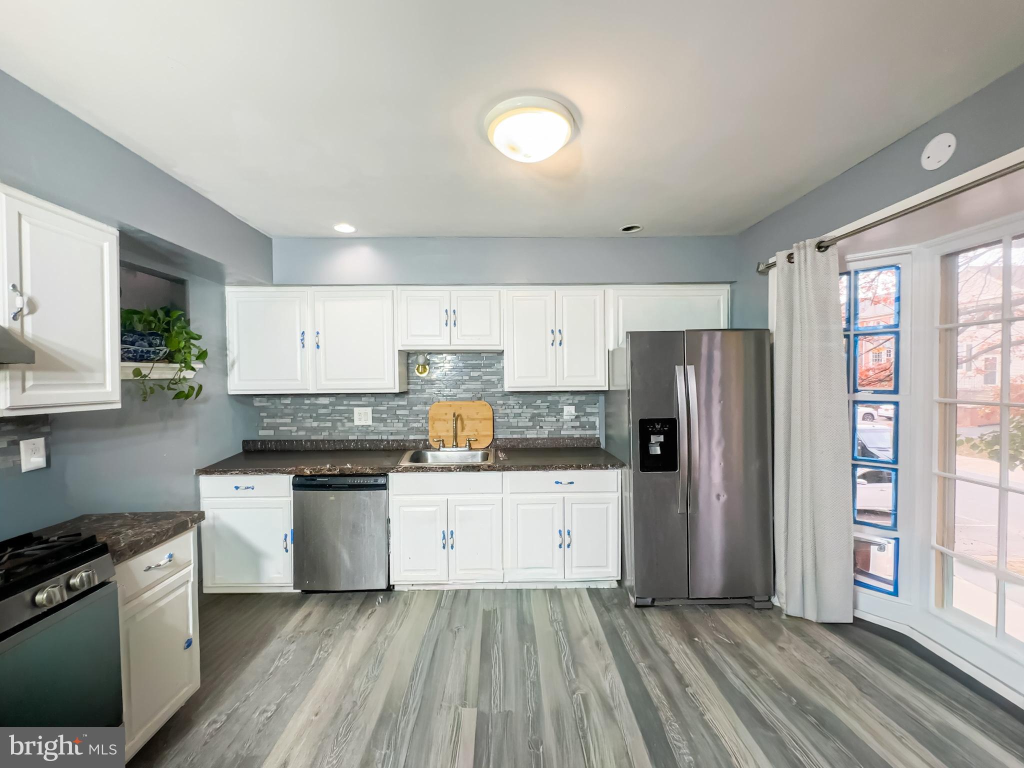 2863 Strauss Terrace Silver Spring, MD 20904 - Photo 2 of 23 a kitchen with stainless steel appliances a refrigerator stove and sink