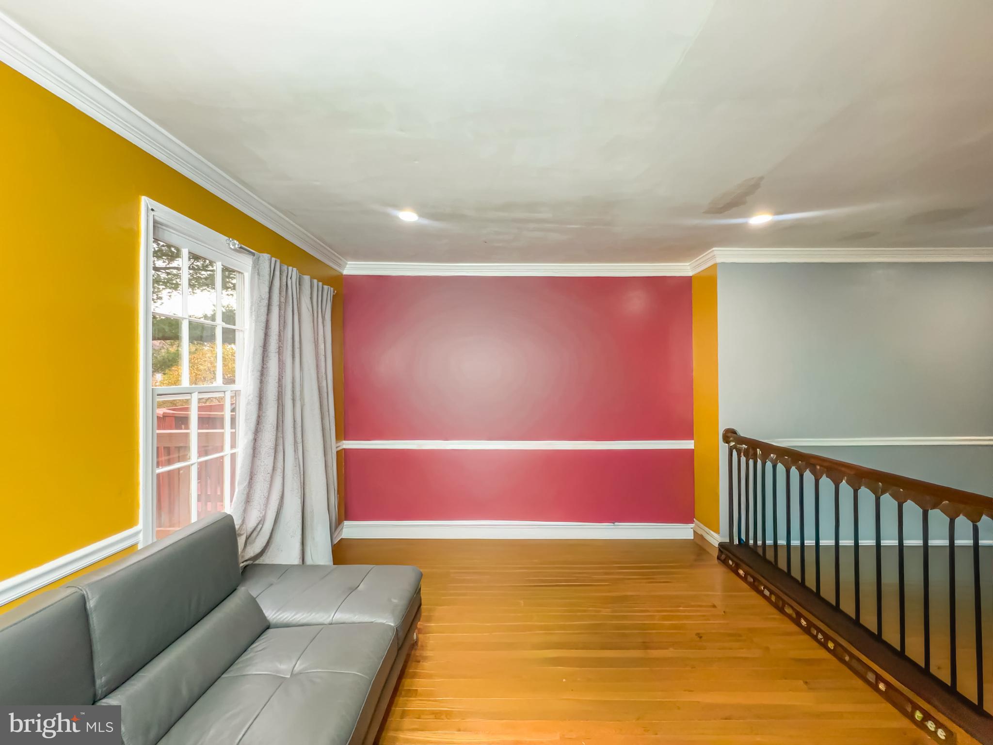2863 Strauss Terrace Silver Spring, MD 20904 - Photo 5 of 23 a spacious bedroom with a bed and wooden floor