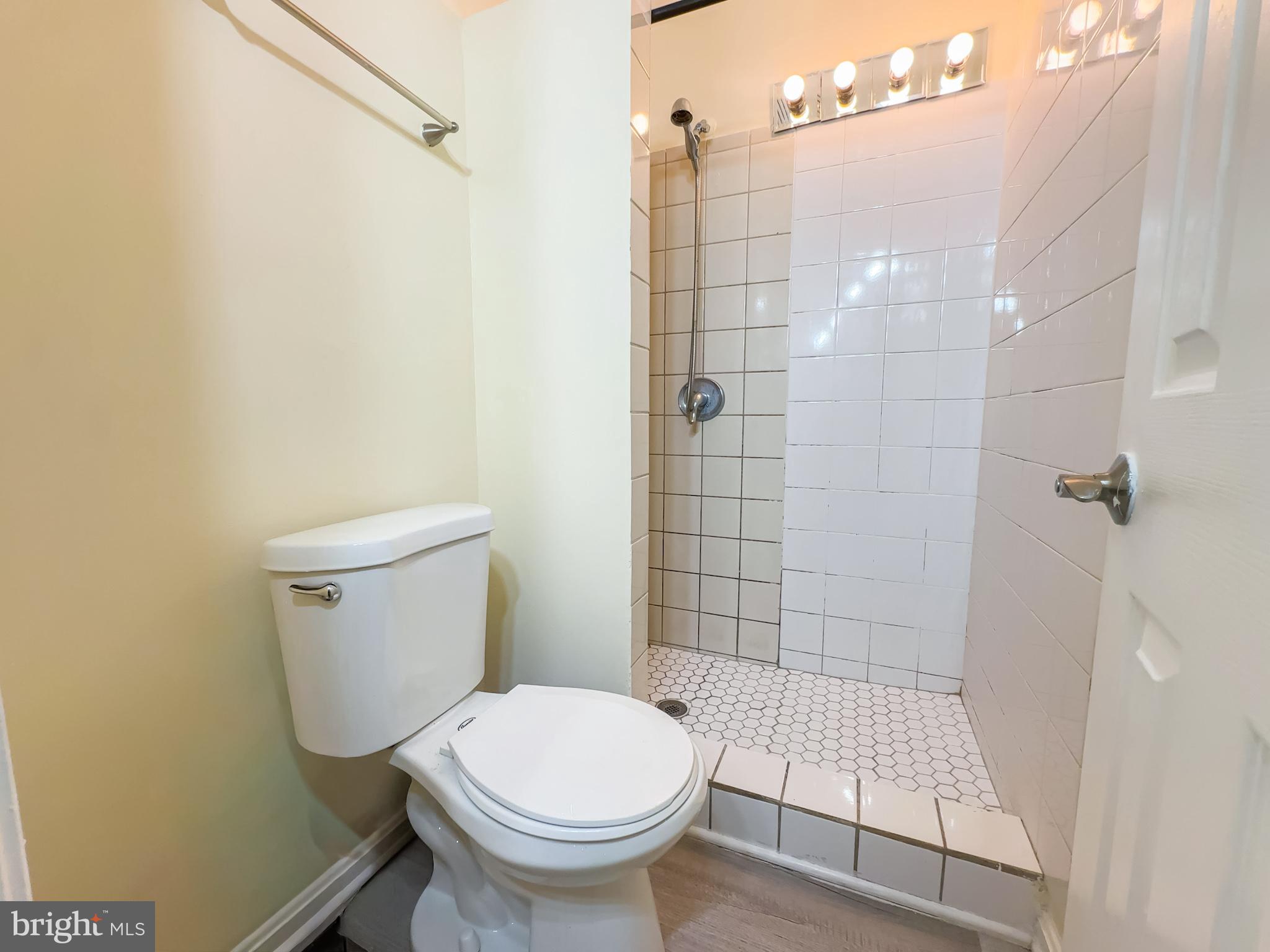 2863 Strauss Terrace Silver Spring, MD 20904 - Photo 9 of 23 a bathroom with a toilet and a shower