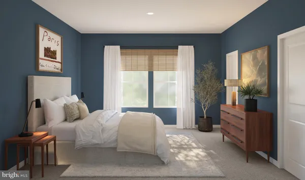 a bedroom with a bed and a couch