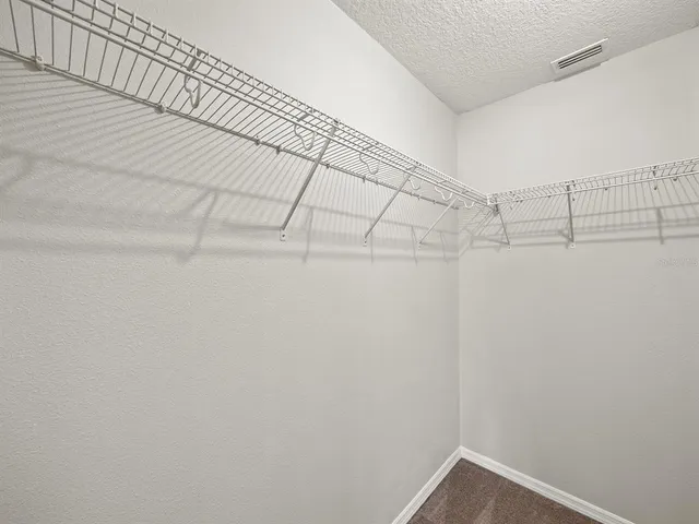 a bathroom with a granite countertop sink toilet a mirror and shower