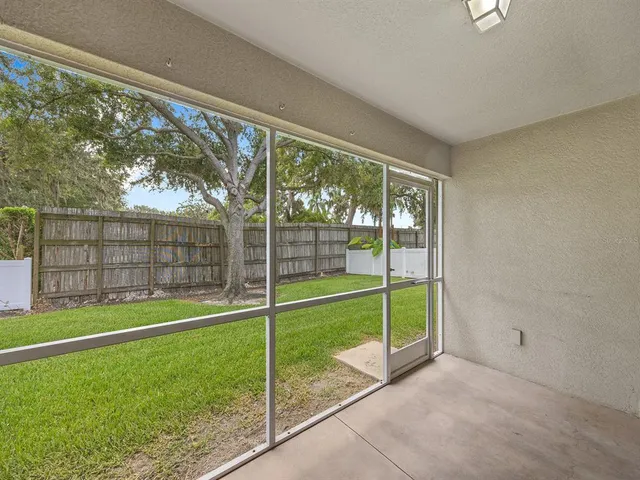 a view of a room with a big yard