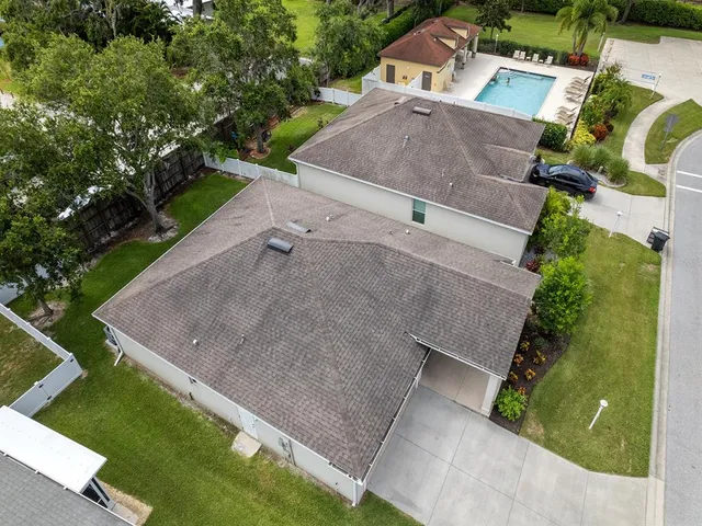 an aerial view of a house with a garden