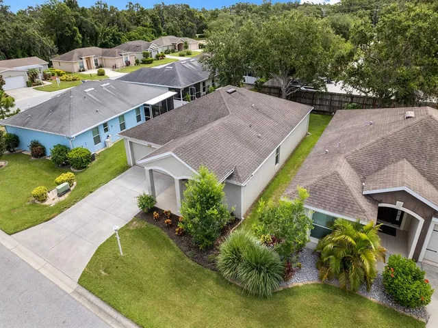 an aerial view of a house with a garden