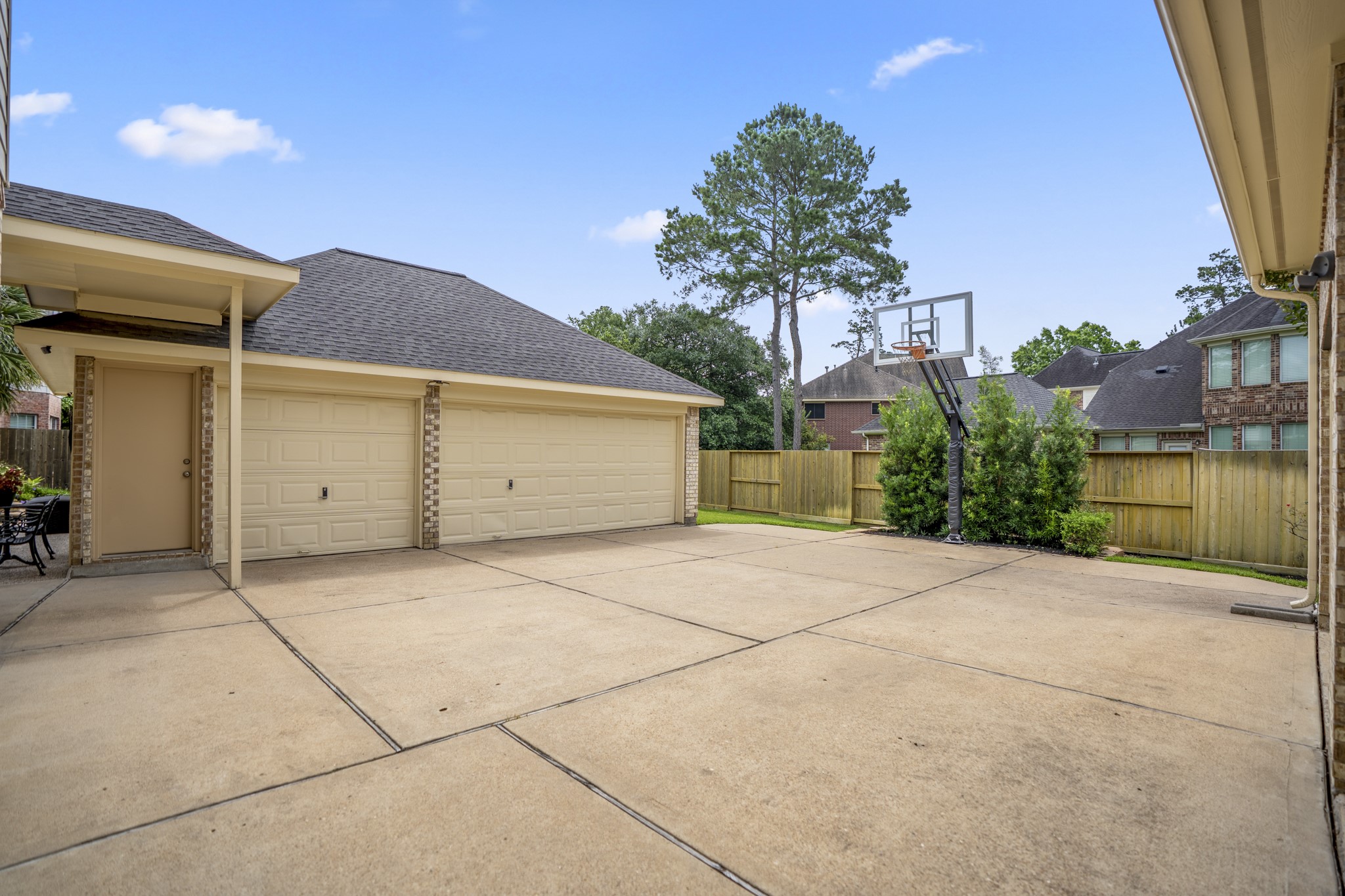 1438 Hatchmere Place Spring, TX 77379 - Photo 39 of 50 The motor court offers a very rare find in the area, a 4-car garage with 1 carport under the porte-cochère. PLUS, an area for children to work off that energy.