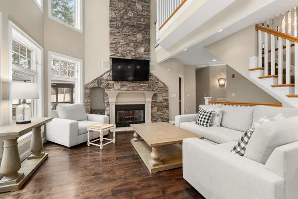 a living room with furniture flat screen tv and a fireplace