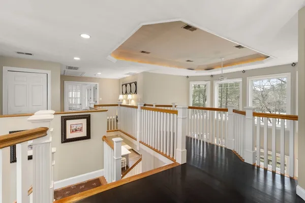 a view of a hallway with seating area