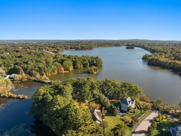 an aerial view of a houses with ocean view