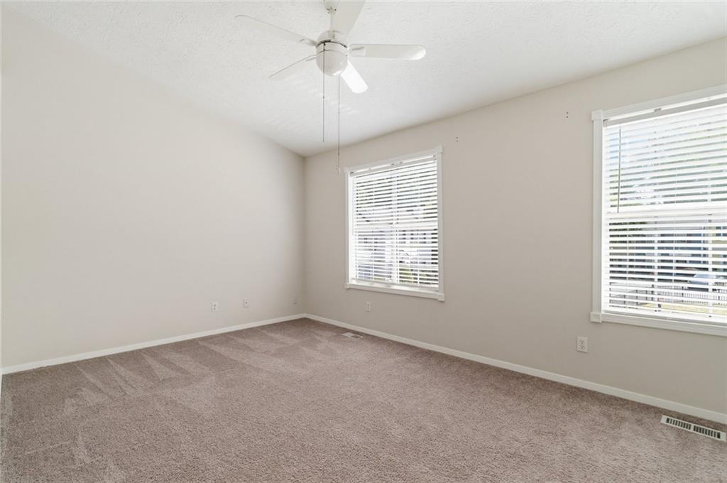 809 Wedgewood Way Atlanta, GA 30350 - Photo 17 of 27 an empty room with a window and a fan