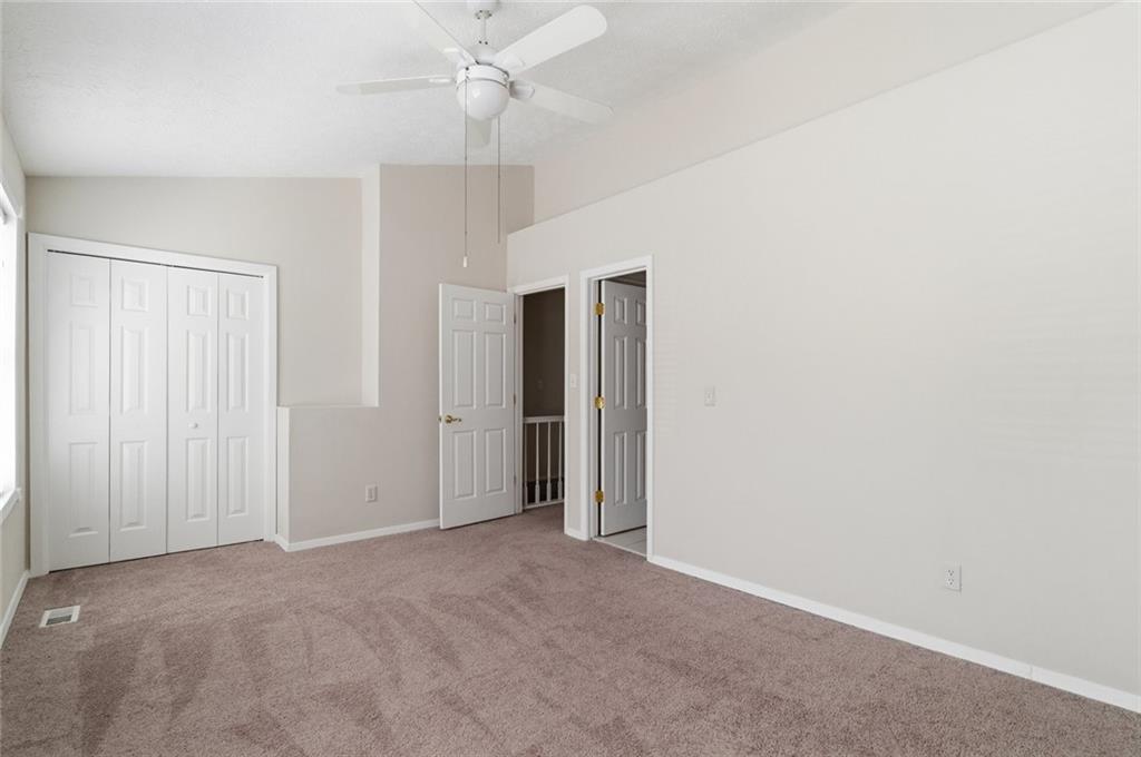 809 Wedgewood Way Atlanta, GA 30350 - Photo 18 of 27 an empty room with a ceiling fan and a window