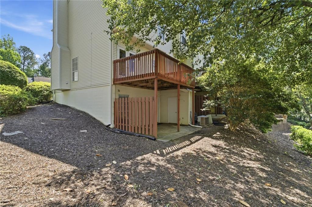 809 Wedgewood Way Atlanta, GA 30350 - Photo 26 of 27 a view of a house with a yard and garage
