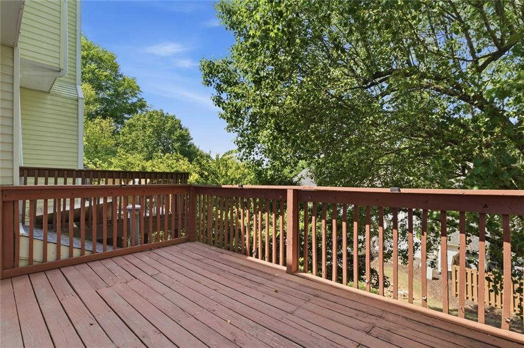 809 Wedgewood Way Atlanta, GA 30350 - Photo 8 of 27 a balcony with wooden floor and fence