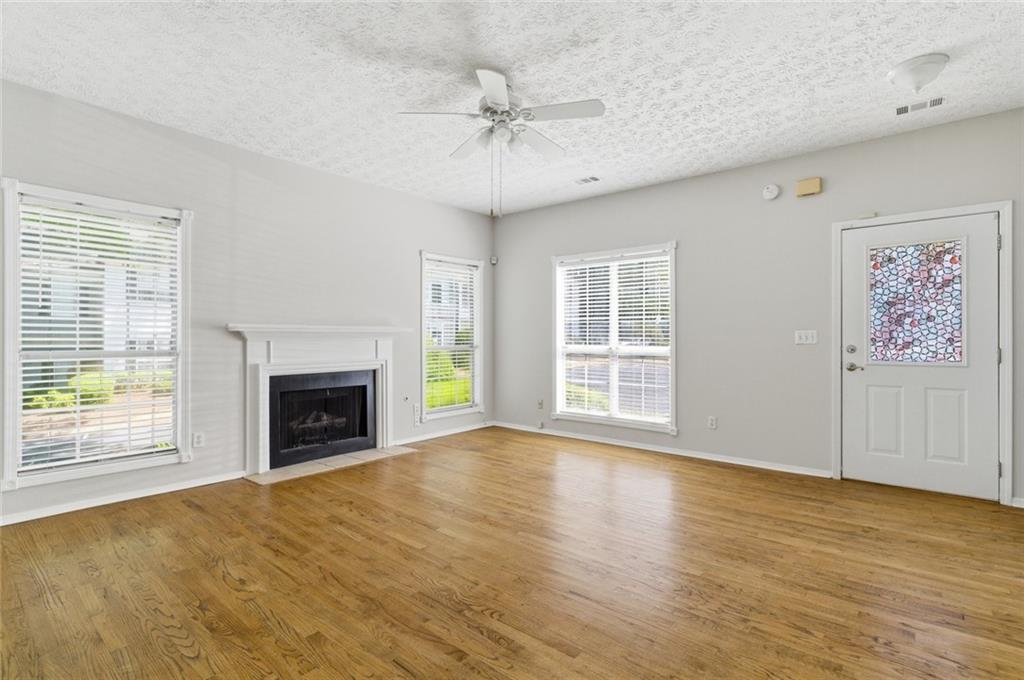 809 Wedgewood Way Atlanta, GA 30350 - Photo 9 of 27 a view of an empty room with a fireplace and a window
