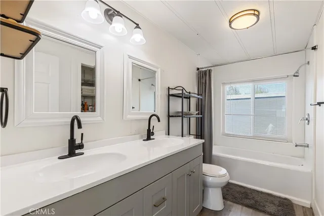 a bathroom with a sink a toilet and a bathtub