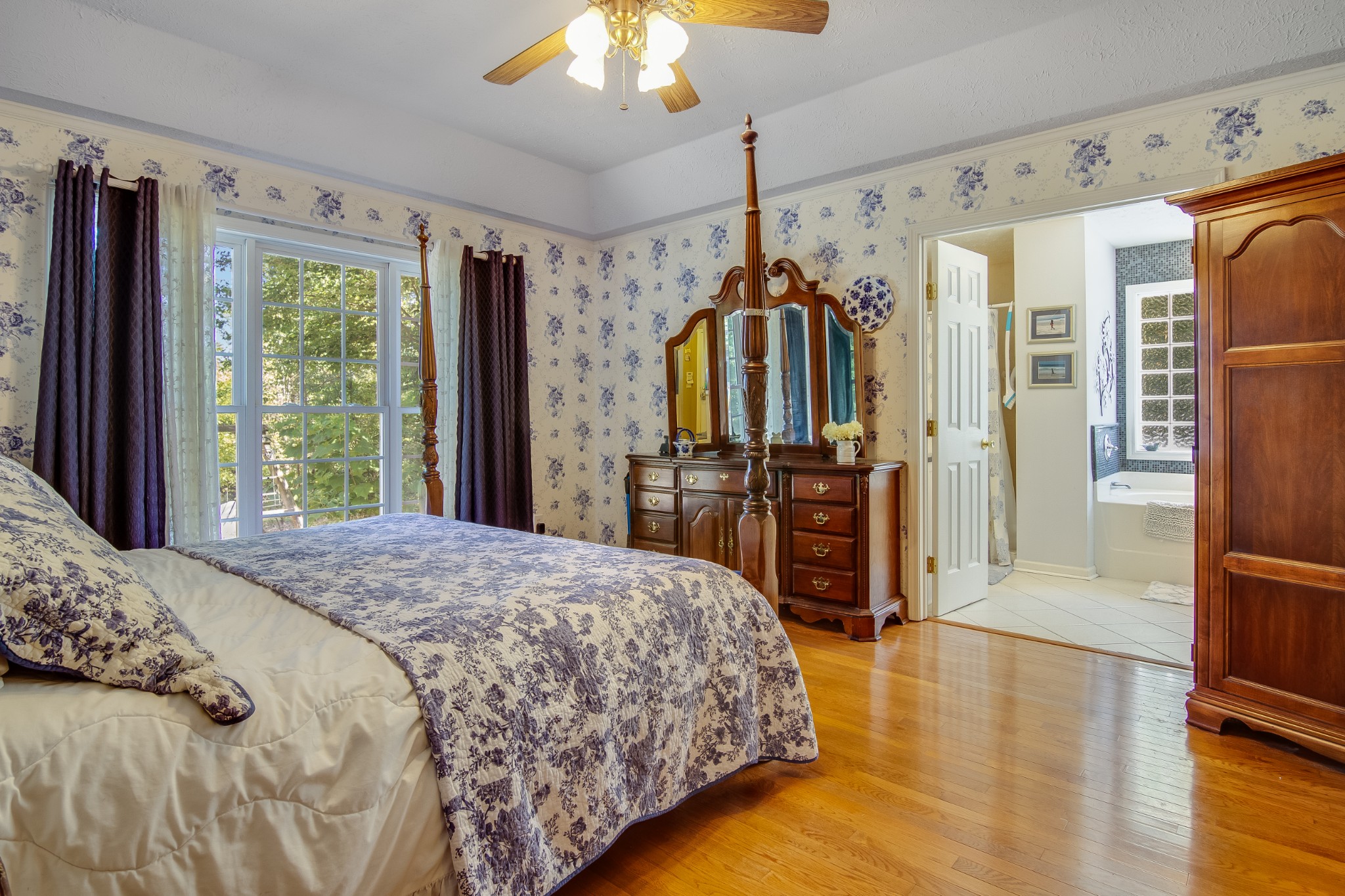 2963 Cole Ridge Road Beechgrove, TN 37018 - Photo 19 of 26 a spacious bedroom with a bed and a dresser with wooden floor