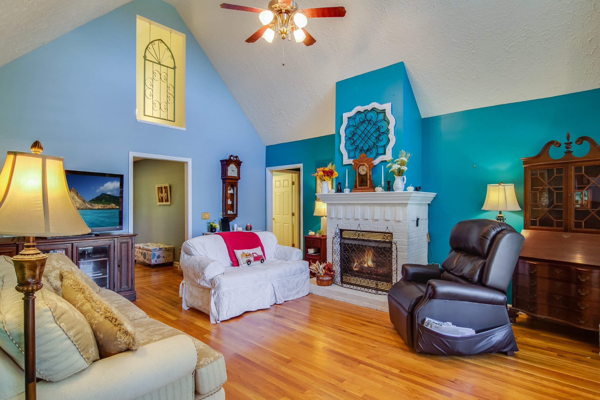 2963 Cole Ridge Road Beechgrove, TN 37018 - Photo 5 of 26 a living room with furniture fireplace and a chandelier