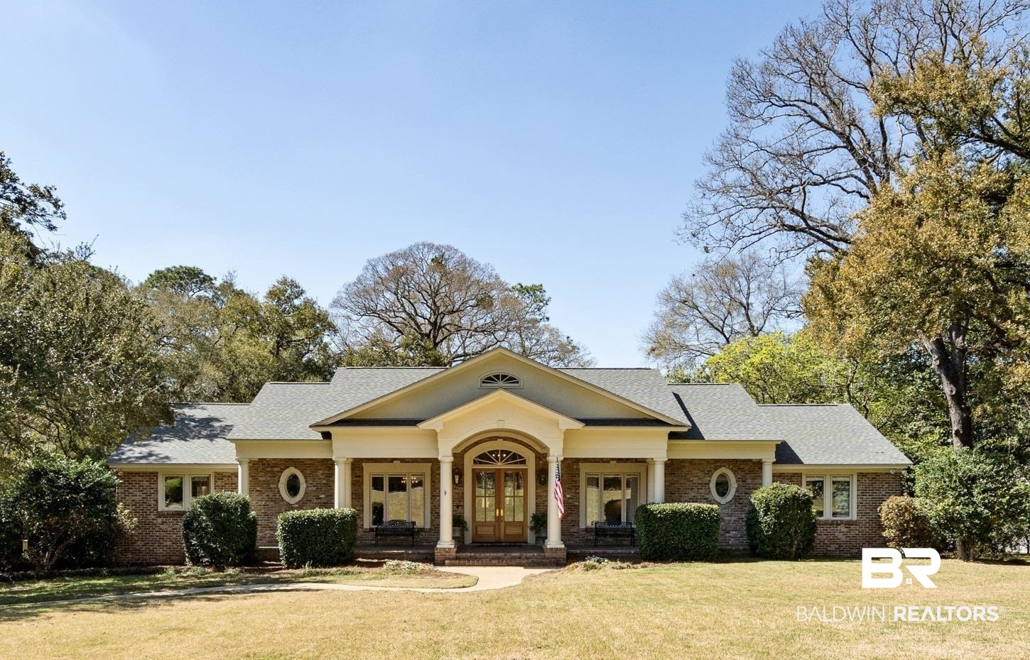 4 Kingsway Mobile, AL 36608 - Photo 41 of 44 Greek revival house featuring french doors, brick siding, and a front yard