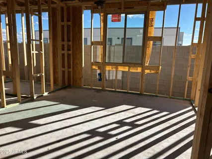 a view of water heater room with windows