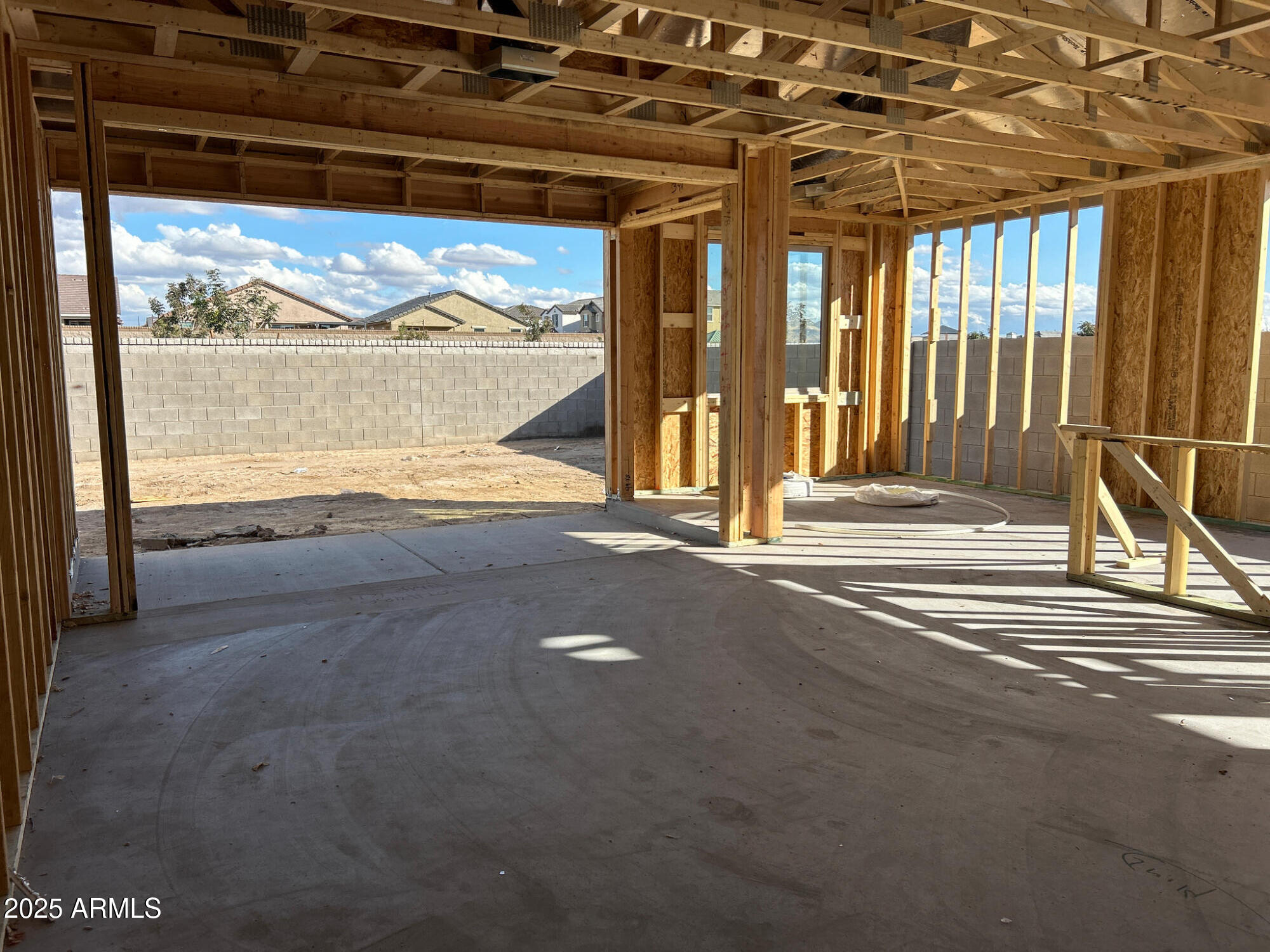32057 Lone Rancher Way San Tan Valley, AZ 85140 - Photo 9 of 36 a view of a room with wooden floor and a floor to ceiling window
